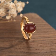 This beautiful vintage red natural agate chalcedony ring is the perfect addition to any collection. Crafted with the finest natural agate chalcedony, this ring is sure to make a statement. Its unique red hue makes it a one-of-a-kind.

Natural agate chalcedony
Jade size: 8*10mm
Copper gold plating
Adjustable ring sizes - one size fits all
Hypoallergenic, lead and nickel free

If you aren't in LOVE with your purchase, please let us know within 30 days of receiving your item, and you'll receive a s Buddha Nature, Ring Settings Types, China Style, Chalcedony Ring, Gold Wedding Jewelry, Natural Wine, Copper Material, Red Agate, Black Agate