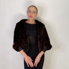 "Here we have an exceptional quality mink for stole coat circa 1940. The fur is so so amazingly soft! It has a variegated color the photos capture and the color does look a little different in different lighting conditions like luxury fur does....there is a sheen to the exceptional quality mink.  The quality is amazing - it is lined and quite warm There is a fur clasp at the front and short sleeves so even open the stole just drapes beautifully Size  This will fit M or smaller in my view - bust is almost one size up to 38\" or so as an approximate measurement  Model is an XS - this garment is cut so beautifully it will sit beautifully on anyone within the above measurements.  Measurements approx taking lying flat with tape measure  16 1/2\" elegant cropped sleeves to wear with long gloves Shrug Jacket, Magazine Pictures, Cropped Sleeves, Fur Stole, Long Gloves, Wedding Formal, Evening Wedding, Mink Fur, Tape Measure