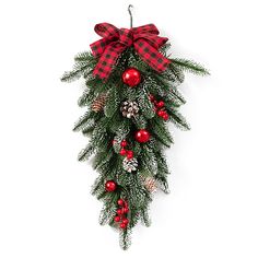 a christmas wreath hanging from the side of a wall