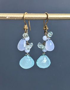 "Faceted Teardrop Chalcedony, Blue Lace Agate and Aquamarine Earrings, Gold Filled Sterling Silver (Vermeil) Wire Cluster Stick Earrings.  Earrings are 1 3/4\" ( 45 mm.) from top of the ear wire to the very bottom gold saucer bead.   Nice gift for her!  * Processing time is 3 - 5 days.  * US orders are shipped first class mail. * International orders are shipped first class international. * Shipping upgrades are available at checkout. Thank you for visiting my listing! Have a wonderful day!" Blue Chalcedony Dangle Jewelry, Blue Drop Earrings With Gemstone Accents, Blue Gemstone Accented Drop Earrings, Chalcedony Dangle Earrings With Matching Jewelry, Chalcedony Dangle Jewelry With Matching Earrings, Blue Natural Stones Long Drop Jewelry, Blue Long Drop Natural Stone Jewelry, Handmade Chalcedony Drop Earrings, Blue Drop Jewelry With Natural Stones