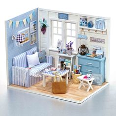 a doll house with furniture and accessories in it