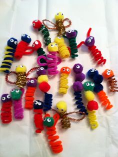 many different colored plastic toys with eyes and arms