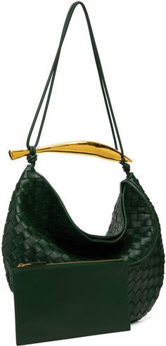 Intrecciato-woven buffed lambskin shoulder bag in green. · Sculptural metal carry handle · Fixed shoulder strap · Magnetic closure · Detachable zip pouch at interior · Unlined · Gold-tone hardware · H13 x W15 x D1 Supplier color: Emerald green Woven Leather Top Handle Shoulder Bag For Office, Office Woven Leather Shoulder Bag With Top Handle, Luxury Green Handheld Shoulder Bag, Luxury Shoulder Bag With Braided Handles, Green Woven Leather Shoulder Bag With Double Handle, Green Evening Hobo Bag With Detachable Handle, Luxury Shoulder Bag With Braided Round Handles, Green Hobo Bag With Detachable Handle For Evening, Green Luxury Hobo Bag With Detachable Strap