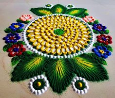 a colorful flower design is on the ground