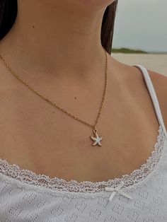 🐚 Gorgeous necklace with white gold enamel starfish and gold chain. Chain is 18.5 in. 100% hand made. Not recommended in water. White Star-shaped Clavicle Chain Necklace, Gold Shell Necklace With Starfish Charm For Summer, White Ocean-inspired Charm Necklace For Gift, Ocean-inspired White Charm Necklace As Gift, Ocean-inspired White Charm Necklace Gift, White Star-shaped Ocean-inspired Jewelry, Ocean-inspired White Star-shaped Jewelry, Ocean-inspired White Star Jewelry, Gold Necklace With Starfish Charm For Beach Season