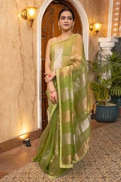 Pista green, silver and gold saree crafted in pure organza silk with broad zari striped pattern and bloom border detailing. Comes with an unstitched blouse piece. - Aza Fashions Gold Saree, Saree Gowns, Dhoti Saree, Cotton Sarees Handloom, Pista Green, Organza Silk Saree, Ruffle Saree, Lehenga Saree, Banarasi Sarees