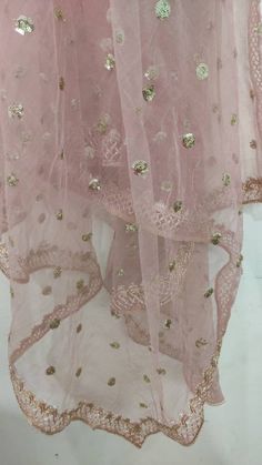 This is a Dupatta made on orders. It is made using dyeable net fabric with gold sequine embroidery all over. We make it colored as shown in the picture. Then we stitch a beautiful golden lace to all sides of it. Dupatta is having a length of 100 inches and width of around 40 inches. I don't keep it readymade I only make it exclusively for my customers. Can be fully customised. Floor-length Net Sharara With Sheer Dupatta, Floor-length Sheer Gold Dupatta, Bollywood Style Sharara With Dupatta For Reception, Festive Pink Net Sharara, Festive Floor-length Net Anarkali Set, Festive Floor-length Chanderi Dupatta, Festive Floor-length Zari Work Dupatta, Anarkali Net Sharara For Eid, Chinon Dupatta For Eid Reception