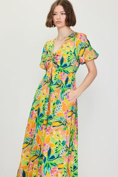 A color palette of mood-boosting brights enlivens this floral-printed midi dress. Framed by voluminous bubble sleeves, it's got a V-shaped neckline with tie detailing that lets you adjust the fit of the bodice. •V-shaped neckline •Adjustable tie detailing •Short bubble sleeves •Elasticized back waist •Mid-length hem Item Number: 99794 Vacation Dresses Casual, Wedding Guest Dress Trends, Casual Wedding Dress, Print Midi Dress, Floral Print Midi Dress, Vacation Dresses, Sweater Sale, Printed Midi Dress, A Color