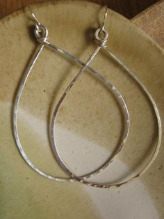 Our largest hoop. Sterling silver is hand formed, hammered and wire wrapped at the top. Approximately 2.5" in diameter. This hoop also comes in teardrop shape. Hammered Sterling Silver Teardrop Hoop Earrings, Hammered Teardrop Sterling Silver Hoop Earrings, Silver Small Hoop Teardrop Earrings With Ear Wire, Hand Forged Teardrop Silver Hoop Earrings, Hand-forged Teardrop Hoop Earrings, Silver Teardrop Hand-forged Hoop Earrings, Silver Teardrop Hand Forged Hoop Earrings, Silver Teardrop Wire Wrapped Hoop Earrings, Teardrop Sterling Silver Wire Wrapped Hoop Earrings