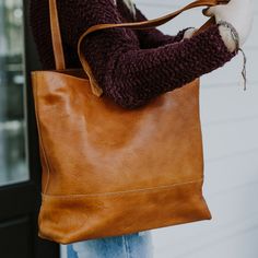 At first glance, you’ll notice the Madison Totes are a work of art. Now whether you choose full leather or waxed canvas is up to you, but as we like to say: “Either choice is the right choice.” But upon closer inspection you’ll realize the true genius to these totes – they are organizational wonders. The Madison Totes are designed with interior pockets to keep your important items separate and safe. There’s an open pocket for your cell phone, two pen slots, and two additional larger pockets for Buffalo Jackson, Tan Leather Tote, Tan Leather Bag, The Madison, Striped Fabric, Waxed Canvas, Small Accessories, Leather Tote Bag, Full Grain Leather