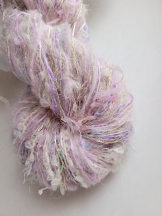 a skein of yarn sitting on top of a white table