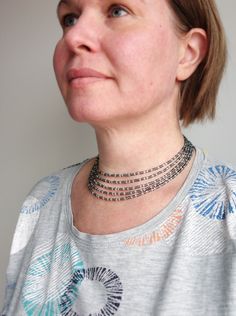 Layered Beaded Choker Necklace Grey Seed Beads Silver Multi-strand Beaded Necklace With Black Beads, Silver Beaded Choker Necklaces With Tiny Beads, Adjustable Silver Multi-strand Choker, Silver Beaded Choker With Spacer Beads, Silver Beaded Choker Necklace With Spacer Beads, Silver Multi-strand Beaded Chain Beads, Silver Multi-strand Beaded Necklace, Adjustable Silver Choker With Spacer Beads, Gray Beaded Multi-strand Jewelry