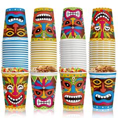 colorful mexican masks are stacked on top of each other in front of a white background