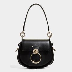 Chloe "Tess" crossbody bag in calf leather Detachable top handle  Detachable, adjustable crossbody strap Flap top with oversized ring accent  Approx. 6.7"H x 7.9"W x 2.8"D Made in Italy Sport Style Outfits, Chloe Tess, Mustang Girl, Saddle Crossbody Bag, Sport Outfits Gym, Princess Gifts, Cross Body Purse, Business Casual Men, Chloe Drew