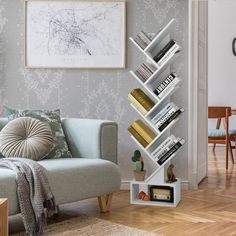 a living room filled with furniture and a white book shelf next to a blue couch