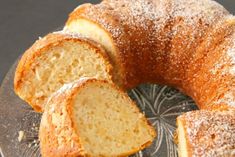 a bundt cake is on a plate with powdered sugar