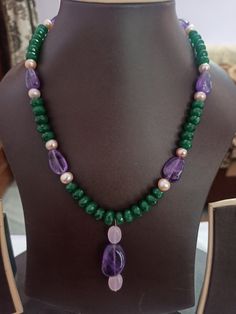 AAA Emerald Beryl Dyed, Fresh Water Pearl Faceted Rondelle 8 mm Beads With Center Tumble Gemstone 20 inch Necklace Stone : Emerald Beryl dyed, Fresh Water Pearl, Amethyst Shape :- Rondelle Size :- 6-8mm 1. Weight :- 246 carat With Amethyst Tumble, 20 INCH Necklace Polish :- Handmade Purity :- AAA color - green, blue It is known as the 'love stone' as the message it emits is the strong vibration of unconditional love, joy, warmth and healing. As quartz crystals are profound amplifiers of energy, Natural Stone Necklaces Handmade, Green Pearl Necklace With Natural Stones, Green Necklaces, Pearl Amethyst, Amethyst Tumbled, 20 Inch Necklace, Carnelian Bracelet, Beaded Necklace Designs, Necklace Stone