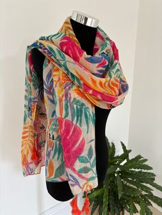 Experience the epitome of comfort and style with our luxurious multi-colored scarf, adorned with vibrant flower and parrot motifs. Crafted from the softest, high-quality fabric, this scarf provides a cozy feel against your skin. The lively design adds a touch of elegance and whimsy to any outfit, making it a versatile accessory for any occasion. Whether you're dressing up for a special event or adding a pop of color to your everyday ensemble, this scarf is the perfect choice. Enjoy the blend of Floral Print Shawl Scarf One Size, One Size Floral Print Shawl Scarf, Multicolor Casual Scarves For Vacation, Casual Multicolor Scarves For Vacation, Bohemian Scarves With Floral Print, One Size, One Size Bohemian Scarf With Floral Print, One Size Bohemian Scarves With Floral Print, Bohemian One-size Floral Print Scarves, Bohemian One Size Floral Print Scarves