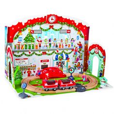 a play set with cars and christmas decorations on the walls, including a red car