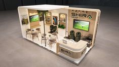 an exhibition stand with tables and chairs in it