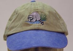 NEW EMBROIDERED RACCOON WILDLIFE BASEBALL HAT (HATS SHOWN ARE KHAKI/ROYAL BLUE, KHAKI/NAVY BLUE, KHAKI/FOREST GREEN AND KHAKI/BLACK) Adams Optimum 6 Panel Two Tone Color Baseball Hat Low Profile - 100% Cotton Twill Adult Cap Pigment Dyed - Garment Washed Hat 6 Panels with Sewn Matching Eyelet Visor with 3 Rows of Stitching Pre-formed Bill - Leather Strap with Brass Grommet Adjustable - One Size Fits Most An Extremely Comfortable Baseball Hat! Enjoy the Embroidered Raccoon Wildlife Hat! We have 6 Different Two Tone Color Baseball Hats Available Please Choose the Color You Prefer! Thanks for Shopping at Price Embroidery & Apparel! Wildlife Outfit Women, Thrifted Wardrobe, Earthy Fashion, Raccoon Hat, Embroidery Apparel, How To Wash Hats, Funny Hats, Embroidery On Clothes, Embroidered Hats