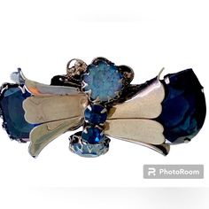 Elegant Blue Jeweled Brooches, Blue Victorian Brooch For Formal Occasions, Blue Victorian Brooches For Formal Occasions, Victorian Blue Brooch For Formal Occasions, Formal Silver Jeweled Brooches, Silver Jeweled Brooches For Formal Occasions, Silver Jeweled Brooches For Evening, Unique Blue Brooches For Formal Occasions, Silver Jeweled Party Brooches