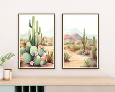 two paintings on the wall of a desert with cactus and flowers in them, one is green