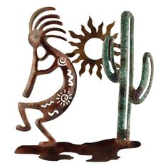 a metal sculpture with a cactus and sun on it