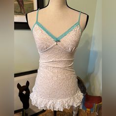 Nwot- Victorias Secret White & Turquoise Sheer Ruffle Lace Nightgown Dress- Size Medium. Adjustable Straps. Sewn On “ Heart Key” And Bow At The Center Of Bust. Stretchy Material In Excellent Unworn Condition. No Snags, Rips Or Stains. Bridal Shower Wedding Night Bachelorette Party Gift Nightie Lingerie Sexy Something Blue Cheeky Victoria's Secret Sleeveless Sleepwear With Built-in Bra, Coquette Fitted Nightgown With Built-in Bra, Fitted Coquette Nightgown With Built-in Bra, Victoria's Secret White Lounge Dresses, Victoria's Secret White Loungewear Dress, White Victoria's Secret Loungewear Dress, White Victoria's Secret Dress For Loungewear, White Camisole Nightgown For Pajama Party, Fitted Lace Nightgown For Loungewear