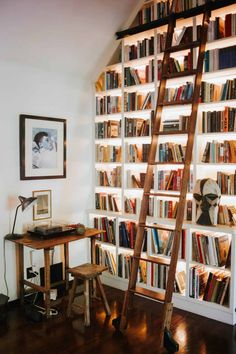 a ladder leaning up against a bookshelf filled with books