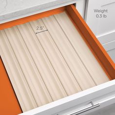 an orange and white kitchen drawer with measurements for the door to be opened or closed