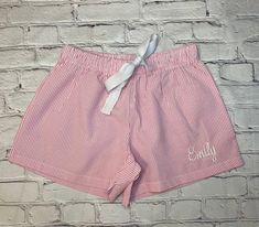 Perfect, preppy and stylish....Our women's seersucker lounge shorts are great for relaxing in style at the beach, by the pool, at the lake, and around the house. Women of all ages wear them for a stylish comfy look to run those quick errands. Ideal for bridesmaid gifts or a pair for each of the women on the family vacation! Trimmed in White Piping Coordinating V-necks available Machine Wash (designed to get softer with each wash --- you'll adore it!) 35% Polyester/65% Cotton (specially blended c Summer Vacation Sleepwear With Built-in Shorts, Summer Pajama Shorts For Sleepovers In Spring, Striped Sleepwear For Summer Sleepover, Relaxed Fit Shorts For Summer Pajama Party, Summer Seersucker Beach Shorts, Summer Beach Seersucker Bottoms, Striped Bottoms For Summer Pajama Party, Summer Sleepover Shorts With Elastic Waistband, Summer Shorts For Pajama Party