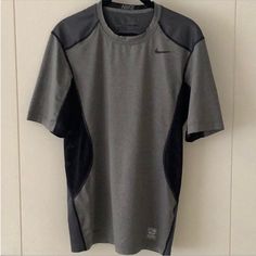 Gray Black Dri-Fit Nike Pro Combat Workout Compression Tee Shirt - Gray Polyester Spandex Stretch Dri-Fit Fabric W/Black Mesh Underarm & Side Insets - Darker Gray Back Panel & Shoulders - Black Flat Seams - Round Neck - Short Sleeves - Compression Fit - New W/Out Tags - Never Worn - Size Small Combat Workout, Grey Sweats, Nike Pro Combat, Compression Shirt, Athletic Shirts, Nike Pros, Nike Shirts, Black Mesh, Workout Tee