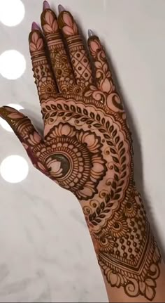 a henna is shown on the palm of someone's hand