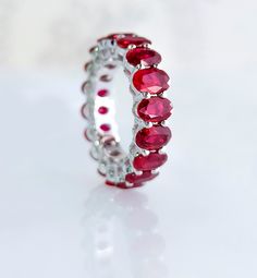 About this item Natural Burmese Ruby Ring | Red Ruby Full Eternity Band | 18k Gold Handmade Vintage Ring | Classic Ruby Jewelry, Gift for her STONE DETAILS : ✦ Stone: Burmese Red Ruby ✦ Stone Type : Natural ✦ Stone Shape : Oval cut ✦ Stone Size : 5x3mm ✦ Stone Weight : 6.74 carats ✦ Stone Grade : AAA METAL DETAILS : ✦ Metal : 18K Gold ✦ Metal Color : Yellow, White, Rose Gold  SHIPPING DETAILS : ✦ Expedited shipping time : 10-12 days ✦ We offer Free Shipping CUSTOMIZATION DETAILS : We can customize any piece of fine jewelry. You can simply message us on Etsy and let us know about all the customization you want. Customization can include : ✦ The Gemstone: This Necklace can be made in Rainbow Sapphire, Emerald, Ruby, Blue Sapphire, Tanzanite, Pink Sapphire, Amethyst, Citrine, Tourmaline and a Rubin Ring, Burmese Ruby, Natural Ruby Ring, Ruby Bands, Rainbow Sapphires, Full Eternity Ring, Ruby Jewelry, Vintage Band, Red Ruby