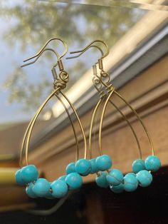 Beautiful handmade earrings. Turquoise Wire Wrapped Beaded Earrings, Handmade Turquoise Teardrop Earrings With Round Beads, Turquoise Teardrop Earrings For Jewelry Making, Elegant Handmade Turquoise Teardrop Earrings, Handmade Turquoise Hoop Earrings, Turquoise Wire Wrapped Beaded Earrings As Gift, Handmade Adjustable Turquoise Teardrop Earrings, Handmade Turquoise Dangle Earrings, Elegant Handmade Turquoise Hoop Earrings