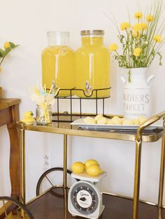 a table with lemons and jars on it