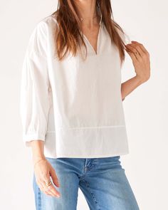 Meet your new favorite blouse—the Sonnet Top. This piece features a gathered v-neckline and a-line silhouette met with elegant blouson sleeves that gather at the cuff for shape. Spring V-neck Peasant Top With Blouson Sleeves, Summer V-neck Top With Elastic Sleeves, Cotton V-neck Puff Sleeve Top For Work, Elegant V-neck Peasant Top For Fall, Classic V-neck Blouse With Relaxed Fit, Fall V-neck Puff Sleeve Top With Blouson Sleeves, Classic V-neck Relaxed Fit Blouse, V-neck Blouson Sleeve Work Tops, Fall V-neck Top With Elastic Sleeves