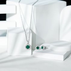 Product Details For those in search of a sophisticated and eye-catching office wear accessory, look no further than this Created Emerald Jewelry Set. Featuring a stunning Round Cut Created Emerald and Zircon in a Halo Style, this gold set is sure to make a statement. Product Information SKU SHP-PENDANT122040744 Length 18.5 mm Width 12 mm Weight 4.88 gm (Approximate) LAB CREATED EMERALD INFORMATION No.of Stones 3 Pieces Total Weight 3.78 Carat (Approximate) Dimension(approx) Round-6X6 mm-2 PcsRound-8X8 mm-1 Pcs Color Green Cut Brilliant Shape Round Setting Type Prong-Setting Quality Grade AAAA ZIRCON INFORMATION No.of Stones 56 Pieces Total Weight 0.99 Carat (Approximate) Dimension(approx) Round-1.20X1.20 mm-36 PcsRound-1.40X1.40 mm-20 Pcs Color White Cut Brilliant Shape Round Setting Type Elegant Green Halo Jewelry, Elegant Green Jewelry With Halo Design, Elegant Green Jewelry With Halo, Green Emerald Jewelry With Halo Detail, Green Emerald Halo Jewelry, Elegant Green Halo Earrings, Anniversary Emerald Jewelry Set In Round Shape, Green Halo Design Round Jewelry, Formal Green Halo Jewelry