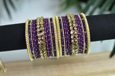 *These are our JASMINE bangles in PURPLE, which are the perfect addition to any outfit.  *Attributes: EACH HAND includes 13 bangles in total. Please see the image for additional details. [BOTH HANDS total is 26 bangles.] *Measurement: Size 2.6 (2.375 inches in diameter) *Ready to ship? YES *Additional colors? NO *Customizable? NO *Includes gift box? NO *This product is handcrafted therefore, minor imperfections may be present. *QUESTIONS? GROUP/BRIDESMAID ORDERS? FIRST TIME BUYING DESI/SOUTH ASI Indian Jewelry Purple, Purple Bangle Jewelry For Wedding, Purple Bangle For Wedding, Purple Bangles, Wedding Color Schemes Purple, South Asian Jewelry, Nikkah Wedding, Pink Bangles, Wedding Bollywood