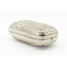 Elegant Judith Leiber silver metal and crystal oblong evening bag clutch featuring a scrolling foliage flower design on a silver - toned metal bag.  The hardware is silver.  It has a silver leather interior with a silver shoulder strap that can be folded inside when you want to wear it as a clutch.  There is a circle that folds out to hold a tassel, but it is no longer there.  Labeled ‘Judith Leiber/New York’ in the interior. 5.5” W x 3” H x 1.5” D  A similar one sold at Chrisities from Joan Riv Designer Rectangular Case Evening Bag, Glamorous Silver Evening Bag With Silver-tone Hardware, Designer Silver Clutch For Formal Events, Luxury Silver Clutch, Designer Silver Clutch For Formal Occasions, Designer Silver Rectangular Clutch, Luxury Evening Clutch With Silver-tone Hardware, Designer Silver Clutch With Silver-tone Hardware, Designer Silver Clutch For Events