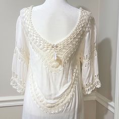 Nwt! Boutique Purchase Can Be Worn As A Swimsuit Cover Up, Tunic, Or Dress Beautiful White W/ Cream Colored Crochet Soft & Lightweight Cotton/Polyester Material Loose & Flowy Fit - Can Also Drape Off Of The Shoulders Deep V-Neck Elbow Length Bust - 36 In. Length - 37.5 In. (From Top Of Shoulder To Longest Part At Bottom) Note: One Tiny Gray Blemish At Bottom Left Hem In The Back (Not Visible Unless Dress Is Stretched Out Flat) - See Last Pic Elegant V-neck Crochet Top With Lace Trim, Cream V-neck Top With Crochet Trim, Elegant V-neck Lace Top For Beach, Cream Lace Top For The Beach, Cream Lace Top For Beach, Elegant White V-neck Crochet Top, White Bohemian Crochet Top With Lace Trim, Fitted Lace Patchwork Top For Beach, Bohemian V-neck Crochet Lace Top