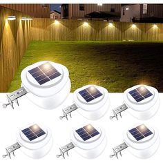 six solar powered lights in the middle of a yard