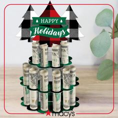 a christmas tree made out of dollar bills with the words happy holidays written on it