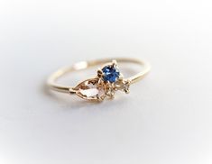 "This timeless wedding band made to fit on top and bottom of the Bella ring. { n o t e } ➤This item is made to order, please allow 2-3 weeks for this ring to be handmade for you. Requested modifications are subject to revised production timelines and pricing. For rush orders, please contact us and we'll do our best to oblige. ➤ For international orders please leaves your phone number in the \"note to seller\" at checkout for delivery purposes. ---------------------- DETAIL ✦Metal Type: 14K Gold, Delicate 14k Gold Sapphire Wedding Ring, Three Stone 14k Gold Wedding Ring, Dainty Sapphire Ring With Rose Cut Diamonds For Wedding, Wedding Sapphire Ring In 14k White Gold, Delicate Gold Sapphire Ring For Wedding, 14k Gold Cluster Ring With Round Band For Weddings, 14k Gold Sapphire Ring With Brilliant Cut For Wedding, Gold Three-stone Sapphire Wedding Ring, Wedding Sapphire Ring With 14k Gold Prong Setting