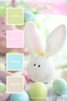 an easter bunny sitting in front of some eggs with pastel colors for the background