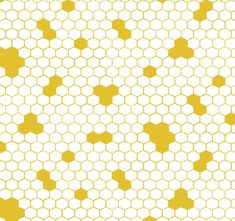 a yellow and white pattern with hexagonal shapes on it's sides,