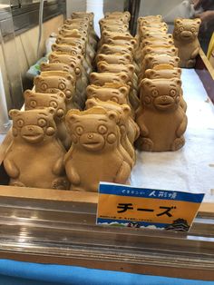 there are many clay animals on display in the store