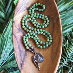 "SACRED ABUNDANCE Jade Mala Beads 108 Buddha Mala Necklace British Columbia Jade Mala Buddhist Amulet Necklace, Ethical Mala Meditation Gift Due to the vintage nature of this amulet, this is a one-of-a-kind design and will not be recreated  NATURAL JADE  Abundance, Health, Inner Peace, Creativity This artisan mala was lovingly handcrafted with: * Natural British Columbia Jade faceted 8mm beads, natural & ethically sourced * Copper (with Patina) Vintage (1970s) Buddha Amulet, blessed in Thailand Spiritual Style Faceted Round Beaded Necklaces, Spiritual Style Round Faceted Beads Necklace, 8mm Beads Amulet Jewelry For Meditation, Amulet Jewelry With 8mm Beads For Meditation, Amulet Style Jewelry With 8mm Beads For Meditation, Spiritual Faceted Beads Jewelry For Meditation, Spiritual Jade Beads For Meditation, Spiritual Jade Beaded Necklaces For Meditation, Spiritual Hand-strung Jade Beaded Necklace