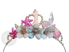 Make a splash with this stunning Mermaid Splish Splash 1st Birthday Bash headband crown. Perfect for a beach or pool party, this tiara captures the magic of the Little Mermaid. Let your child shine on their special day! Rhinestone Metal Crystal crown- That will last for many years to come and will make great keepsake.   To Choose the style that you like - You need to click each style in the scroll down menu and the pictures change according to the style that you click :) Personalized First Birthday Tiara, Baby Princess Tiara, Number Personalized Baby Birthday Crown Tiara ,Girls 1st Baby Birthday Headband Crown.  ONE SIZE   Fit baby, toddler kids and adults  If you buy crown please Enter the NUMBER that you want on the crown. The color of the number can be custom from The  available colors Baby Birthday Crown, Ariel Little Mermaid, Crown Pink, Headband Crown, Birthday Tiara, Birthday Headband, Pool Birthday, Mermaid Outfit, Crystal Tiara